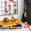 Backpack Buddies atslēgu piekariņu komplekts Paladone Super Mario, CDU ar 24 gab. – dažādi tēli, kolekcionējami aksesuāri