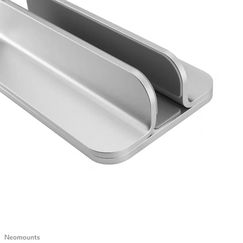 Neomounts NSLS300SILVER vertikāls portatīvā datora turētājs, 11–17 collas, līdz 5 kg, alumīnijs, augstuma regulēšana 42 mm, platuma regulēšana 150 mm, dziļuma regulēšana 92 mm, sudraba krāsas
