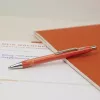 Schneider Epsilon lodīšu pildspalva oranža ar zilu tinti 138606