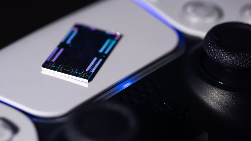 Console processor chip resting on a game controller