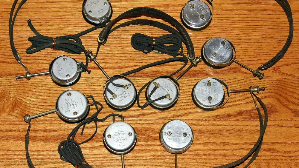 Set of headphones on a wooden floor